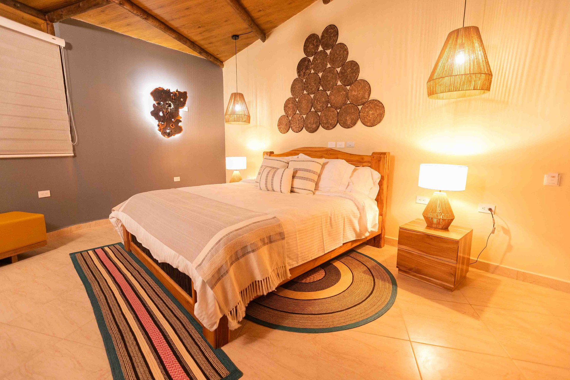 Boutique guest room with king bed at Marahuaco Beach House Cartagena Habitación boutique con cama king en Marahuaco Beach House